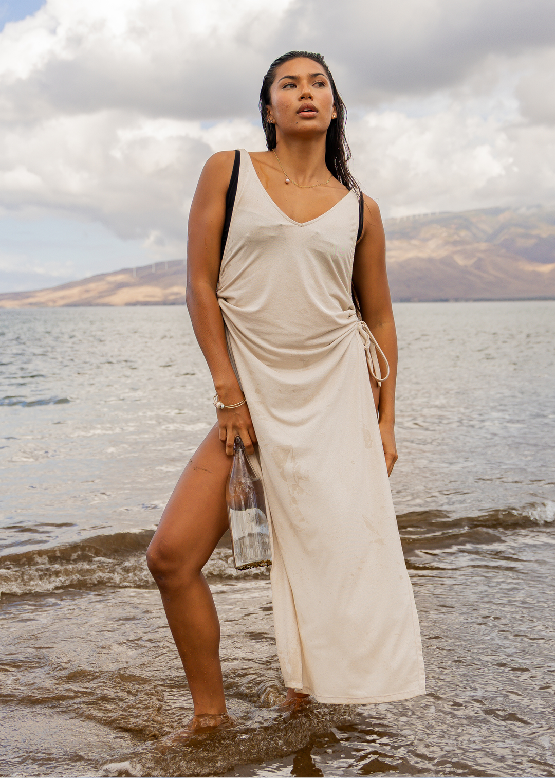 Isola Maxi dress champagne on model in ocean front | Model wears size XS/S • 5'8" • US2 • 32C